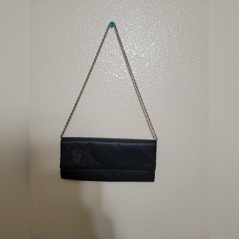 Black clutch purse with silver strap